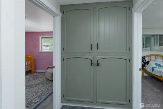 Linen cabinet situated between the second and third bedrooms
