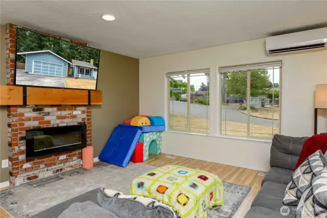 Sunken livingroom is a cozy escape to relax and a perfect place to entertain or just unwind and enjoy a movie.