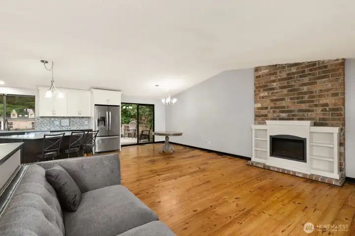 Electric fireplace (stays) sits in front of original wood-burning fireplace.