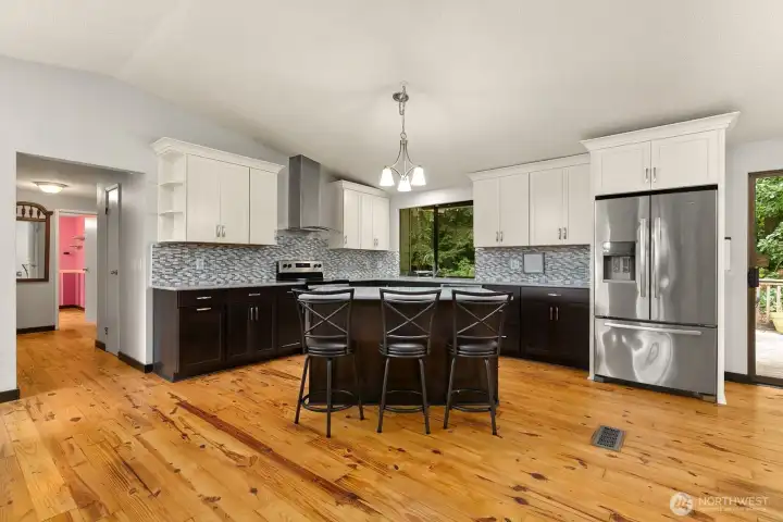 Updated kitchen opens to main living space, making everyday living and entertaining easy.