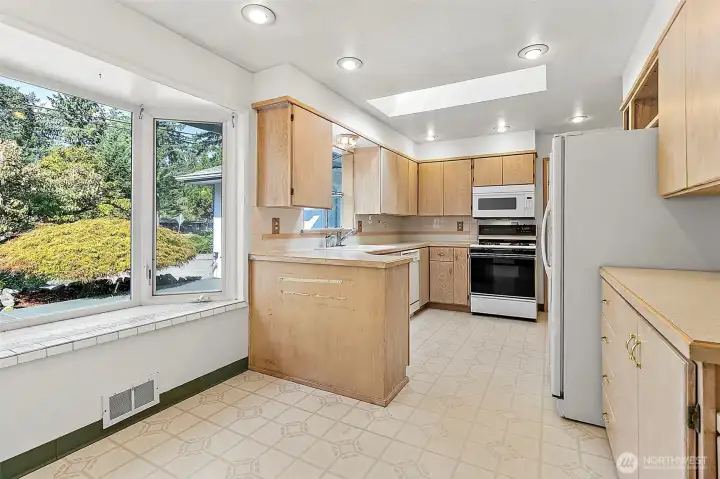 Generous sized kitchen with eating space and plenty of cabinets