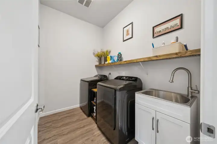 Laundry room with sink and shelving
