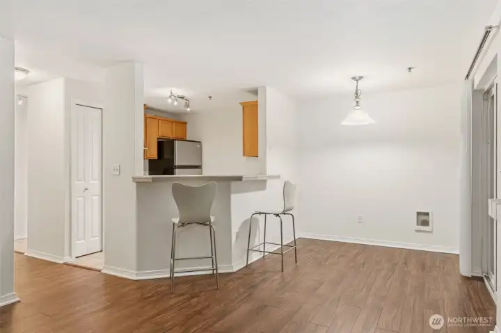 Kitchen island with seating, connecting to the living and dining room.