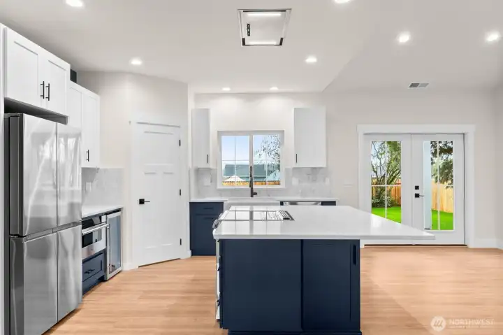 Premium appliance package includes an LG InstaView Smart Range with ProBake Convection and Air Fry, Wi-Fi enabled dishwasher, and a Samsung counter-depth refrigerator with beverage center.