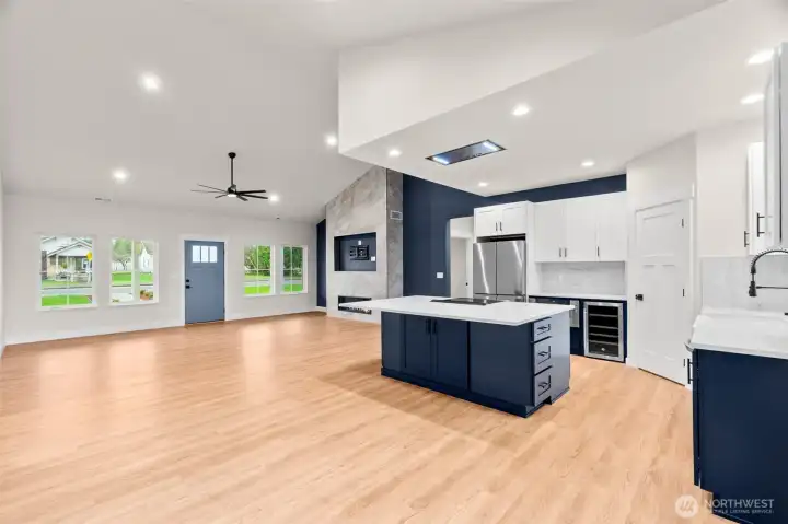 Another view of the main living room looking towards the front door. The two guest bedrooms and bathroom are to the left, primary suite and laundry are to the right.