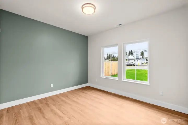 The second guest bedroom that faces the front of the home. Insulated interior walls sound proof the home.