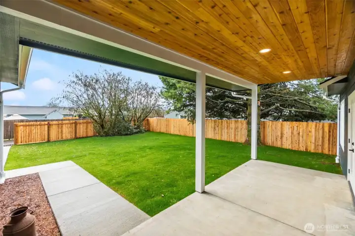 Inviting covered back porch—perfect for relaxing, entertaining, and enjoying the outdoors year round.