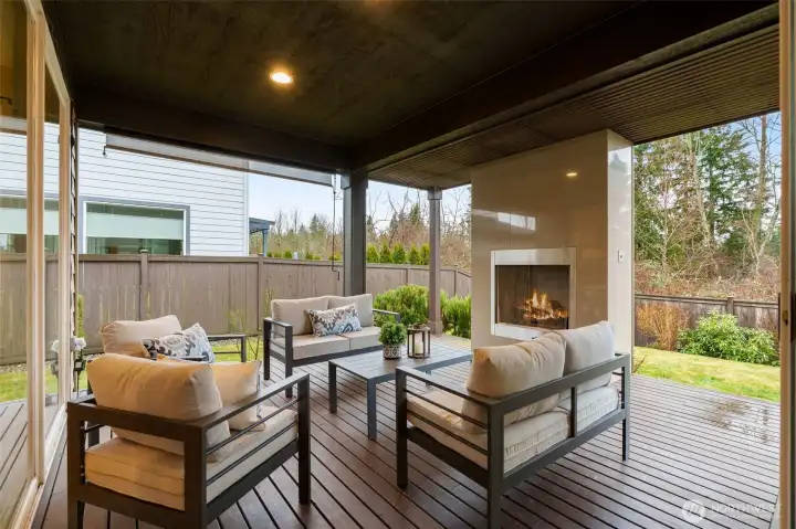 A fully covered outdoor deck living room with gas fireplace and permanent natural gas stub for your barbecue.