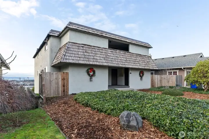 Sought after Grand Ave location! Positive cash flow 4-plex with secure parking, storage, and incredible sound and mountain views.