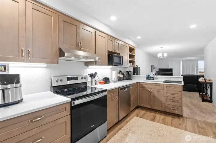 One of the upper floor units with a full refresh in last couple years. Includes new cabinets, quartz counters, new flooring, trim, lighting, and more.