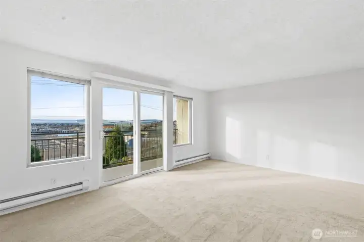 Main level unit balcony, living room, and view. Great for owner occupied or will lease quickly.