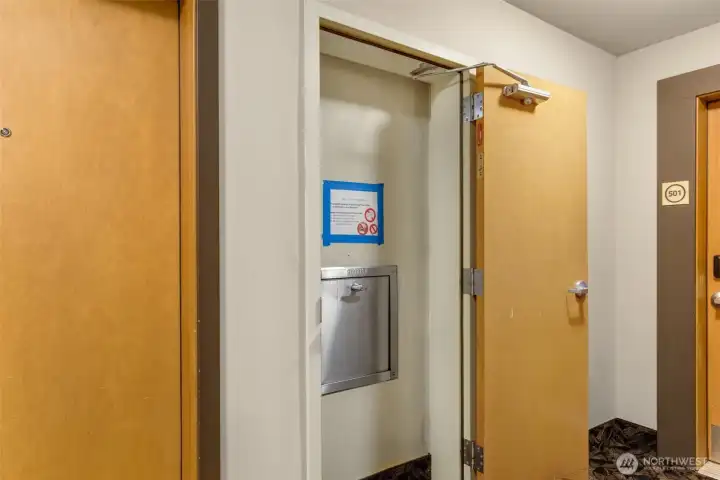 Trash chute at ends of halls are convenient & keep building cleaner!