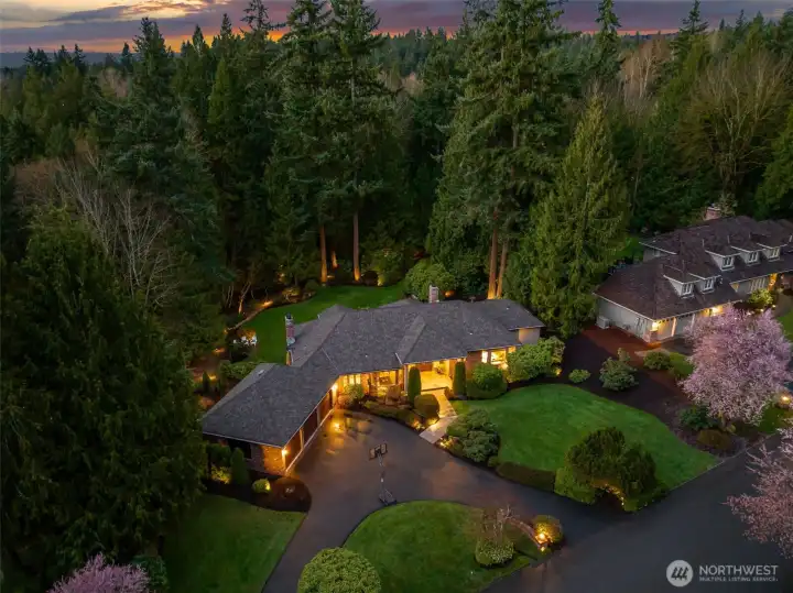 Sprawling Estate on shy acre lot. Lined with mature trees & native landscaping.