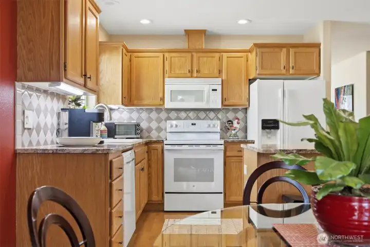 This kitchen has all recently updated appliances (except the microwave) and the granite counter and oak cabinets are loke brand new!