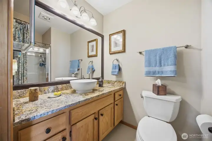 The 3/4 bath is adjacent to the second bedroom and just down the hall from the living room.