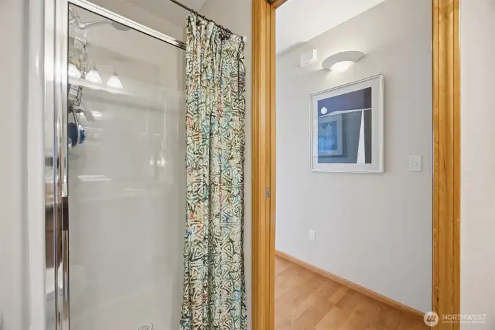 The 3/4 bath that is adjacent to the second bedroom and down the hall from the living room.