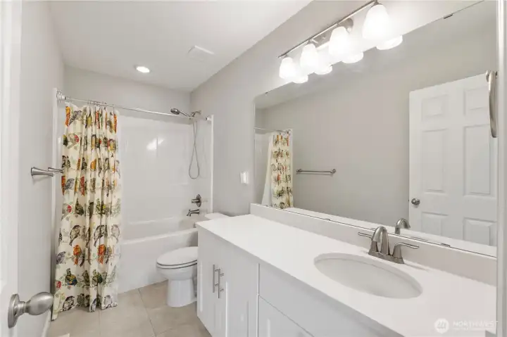 This full bath is in close proximity to upstairs bedrooms.