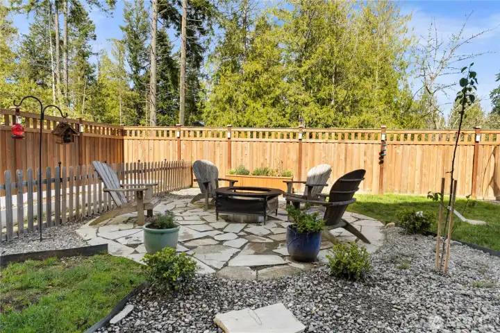 Great outdoors! Great seating and firepit. NOTICE THE HUGE GARDEN SPACE TO THE LEFT OF THE MINOR FENCE. Room for ALL the vegies you want!