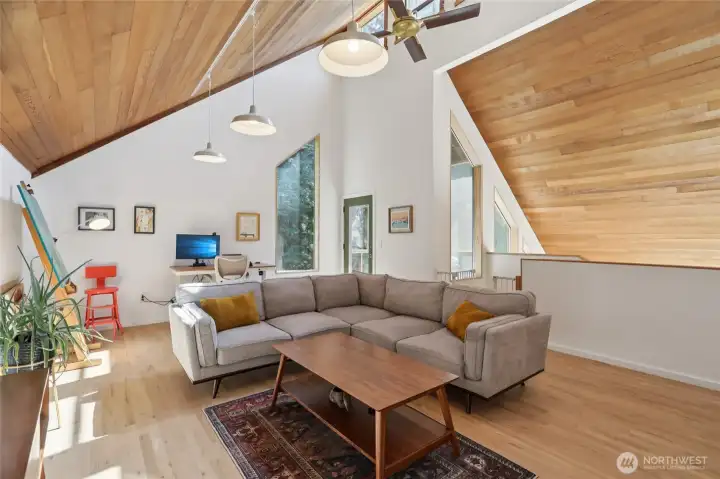 Stunning wood ceilings. Glass door leads to screened in porch