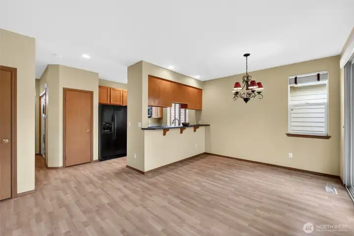 Open-concept design creates a seamless flow between living, dining, and kitchen spaces.