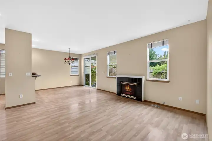 Cozy gas fireplace anchors the living space, perfect for relaxing nights or gathering with friends.