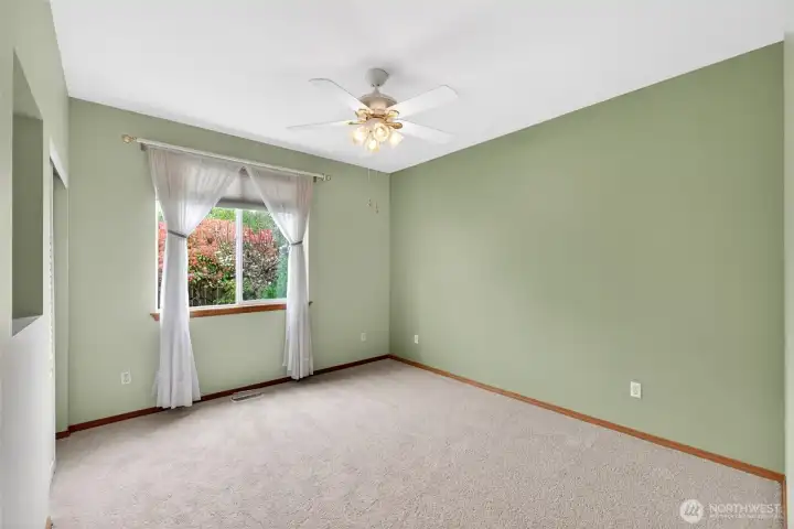 Privately positioned primary suite offers a quiet retreat at the end of the day.