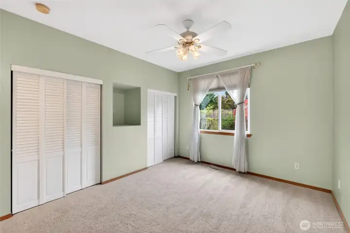 Primary bedroom is tucked away for added separation, creating a calm and comfortable personal space.