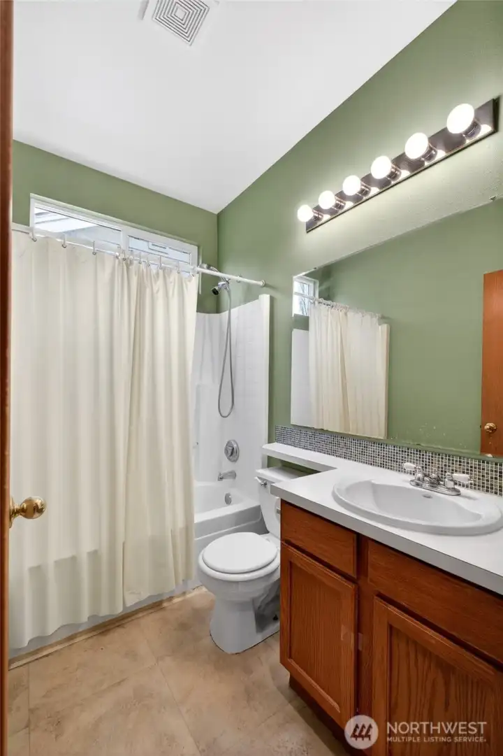 Well-appointed primary bath designed for comfort and convenience.