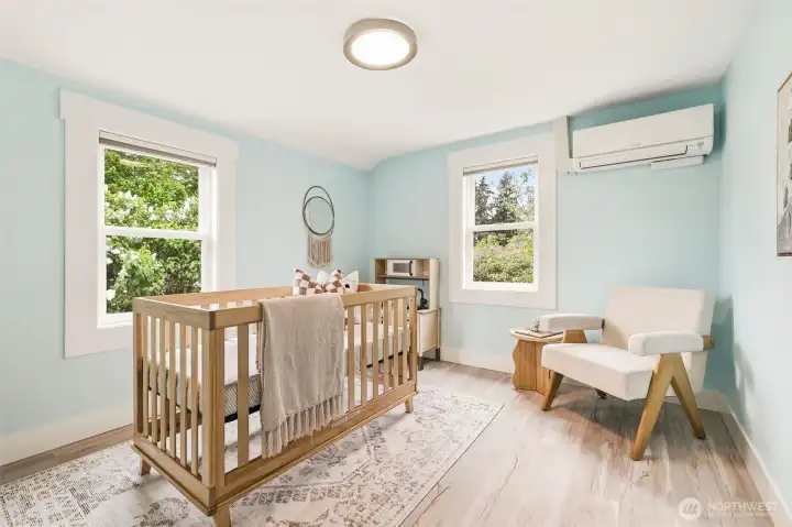 Spacious main floor bedroom with custom closet and ductless mini-splits