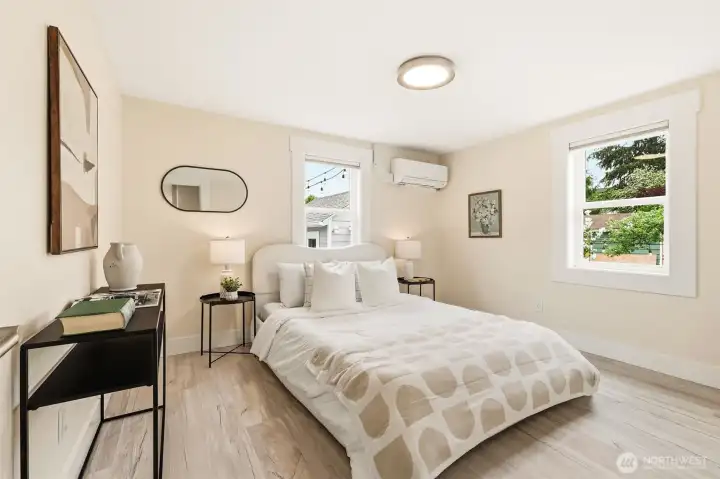 Second spacious main floor bedroom with private garden views and ductless mini-split