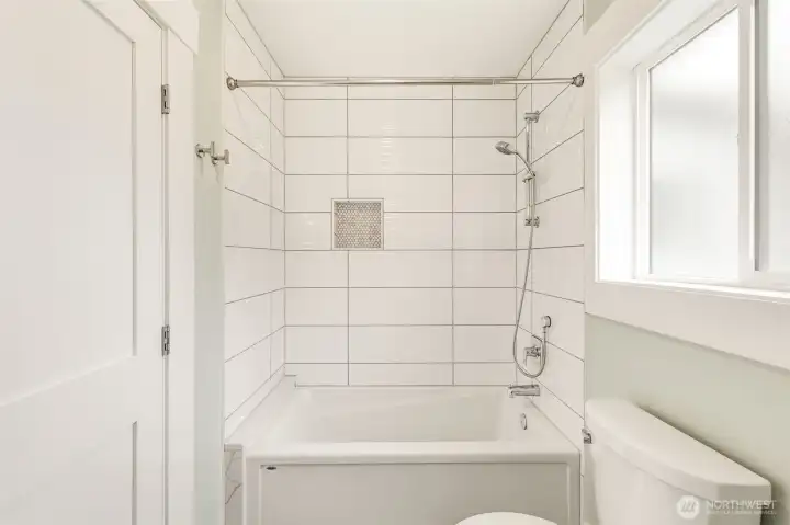 Fully tiled bath and shower surround