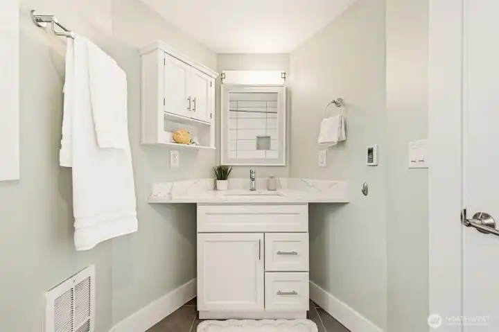 Custom cabinetry in this spacious main floor bathroom