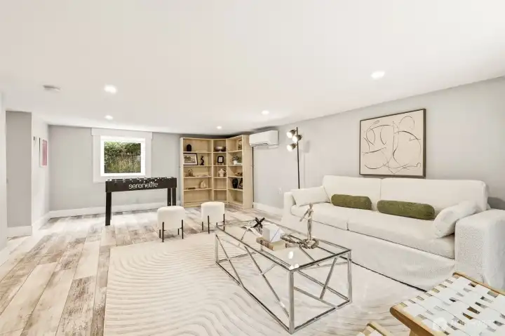Engineered hardwoods, oversized windows and built-ins create the perfect back drop for the perfect recreation/media room