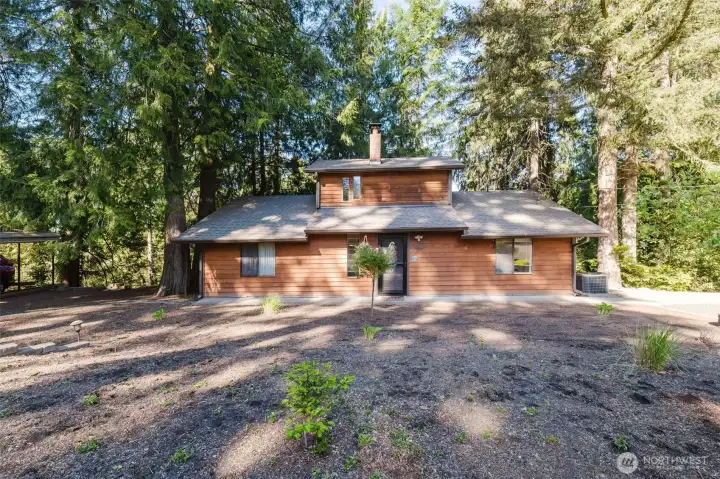 Stunning home with redwood plank siding