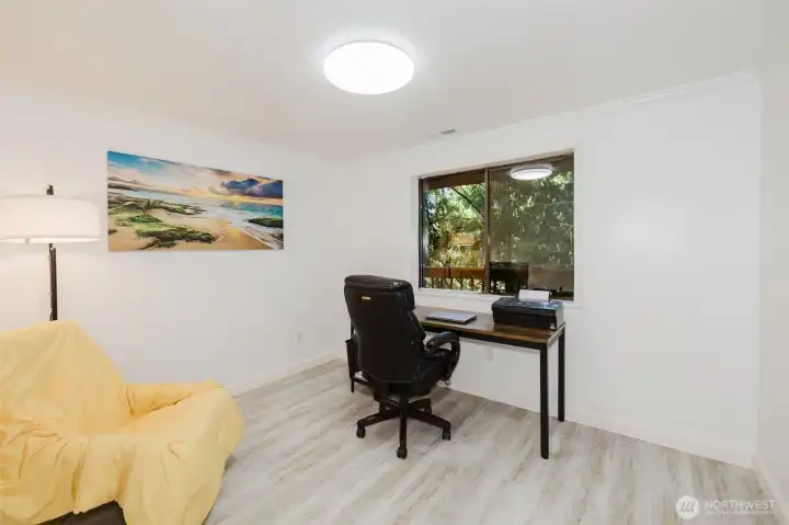 The other bedroom on the main floor.  Currently used as an office.  Window overlooks the back of the house toward the lake.