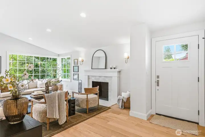 Warm engineered hardwood floors flow throughout.