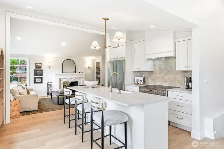 The spacious island is perfect for serving, morning coffee, or leisurely weekend brunch while watching the chef at work.