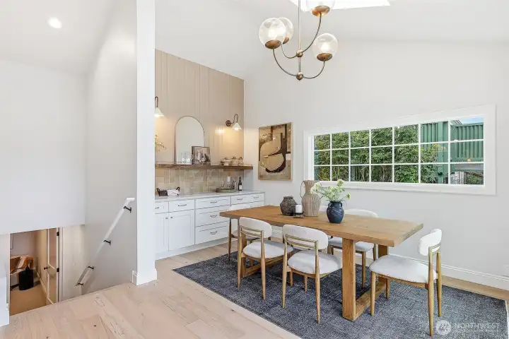 A vaulted addition not only opened up this space even more, but added this stately dining space. Cabinet at lower left has an outlet for a discretely stowed microwave (not included).