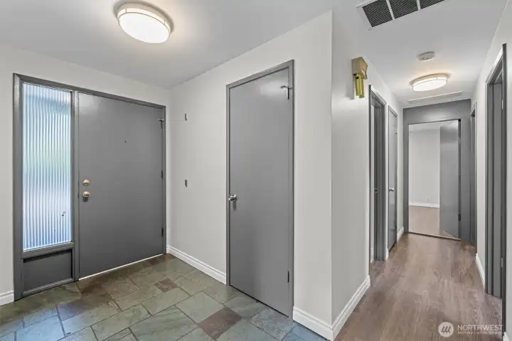 Front entry with coat closet, hall to bathroom, bedroom 1, bedroom 2, and bedroom 3 Front entry with coat closet, hall to bathroom, bedroom 1, bedroom 2, and bedroom 3