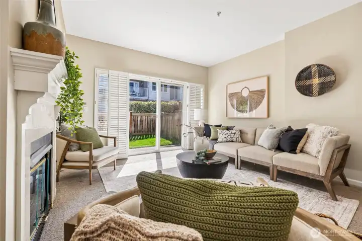 The living room opens to the cute yard.