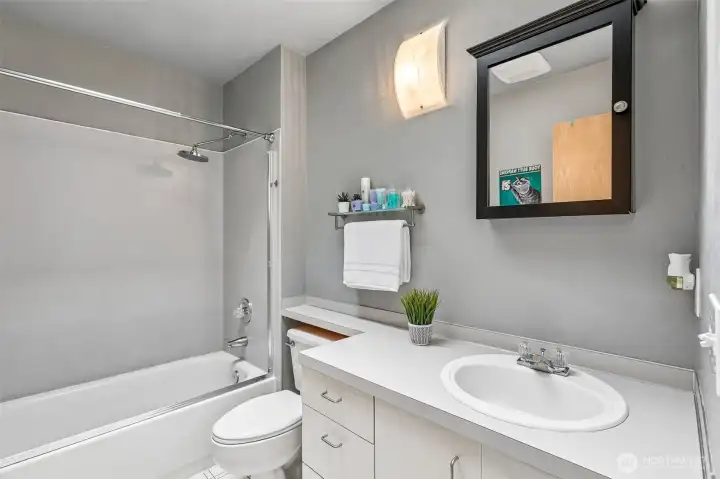 The full bathroom includes a tub and shower combination, skylight and ample vanity storage. The full bathroom includes a tub and shower combination, skylight and ample vanity storage.