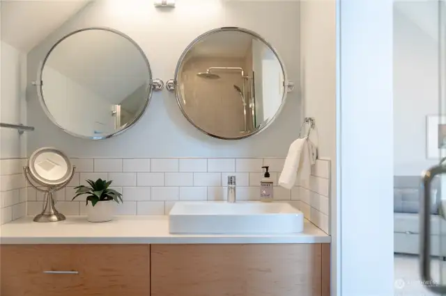 View 1 of Upper Level Primary Bedroom w/ on-suite bathroom w/ custom vanity and tile and glass shower.