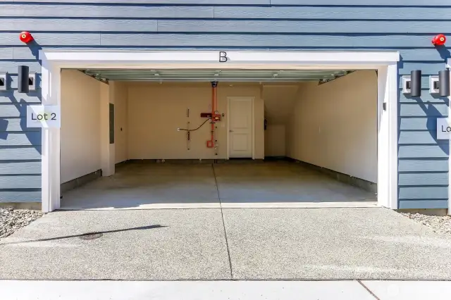 Side x Side 2 car garages with nook for storage. Garages include sheetrock, painged, and EV outlet.