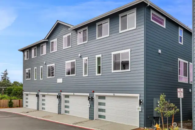 Exterior - garage doors have frosted windows that let in natural light.