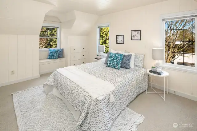 Larger upstairs bedroom with window seat & built-ins