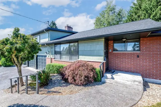 Beautiful landscaping surrounds your front entry
