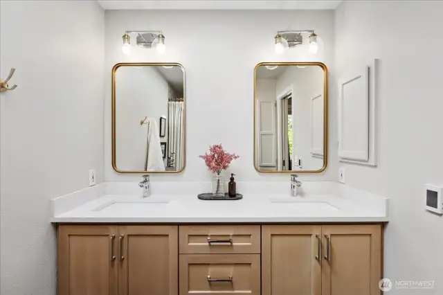Custom rift white oak vanity with two sinks and quartz countertops