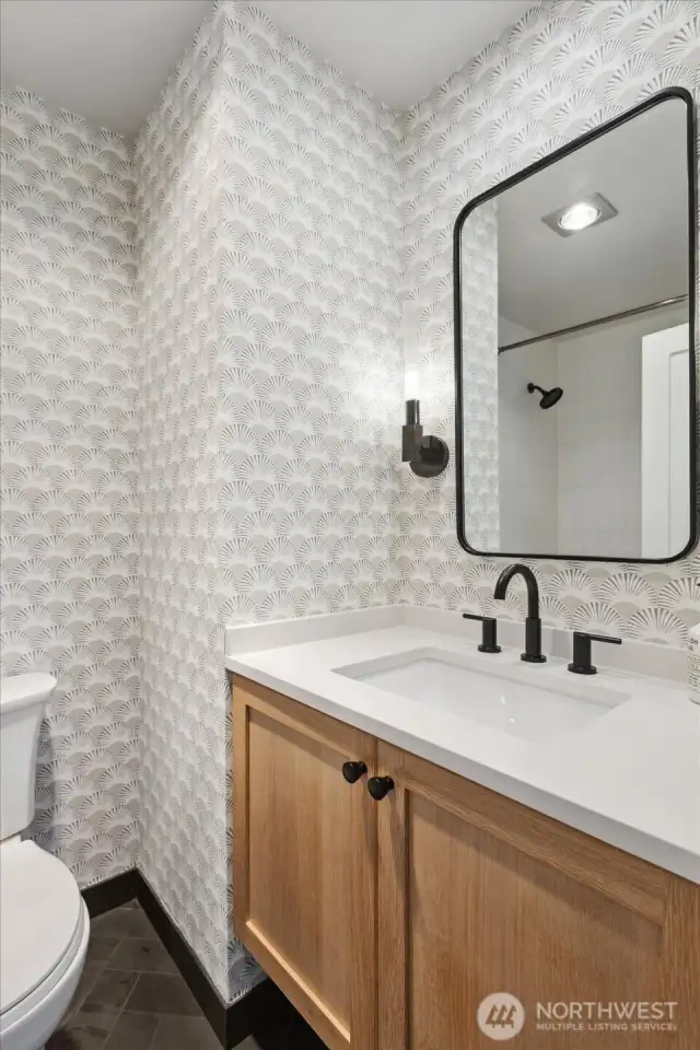 Upstairs guest ensuite bathroom with wallpaper, custom floating vanity, new tile and quartz countertops