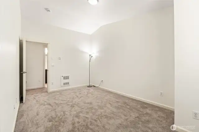 Spacious top floor bedroom with vaulted ceilings, large closet and brand new carpet.