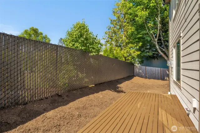 Deck off the back of the home. Great for entertaining!